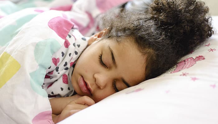 girl sleeping in bed