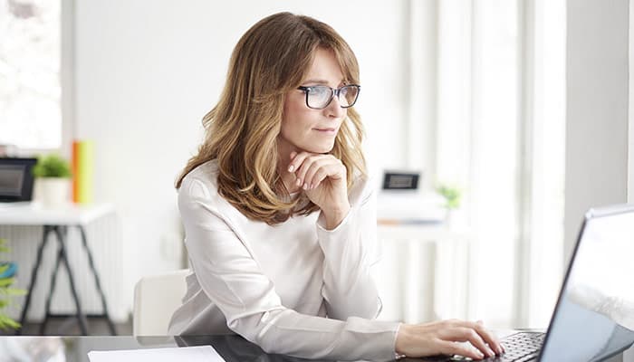 multitasking businesswoman working in her office